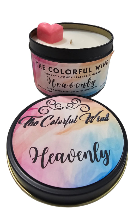 Heavenly medium candle in black tin with pink, blue, and gold label